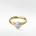Kentia Engagement Ring by Lark & Berry in yellow gold, featuring a central oval diamond with two round accent diamonds.