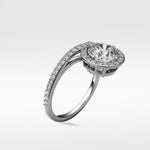 The Wild Cherry Diamond Engagement Ring shown at an angle, featuring a round halo setting and pavé bypass band.