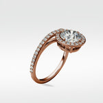 Wild Cherry Diamond Engagement Ring in rose gold with a round halo and pavé diamond band, shown on a white background.