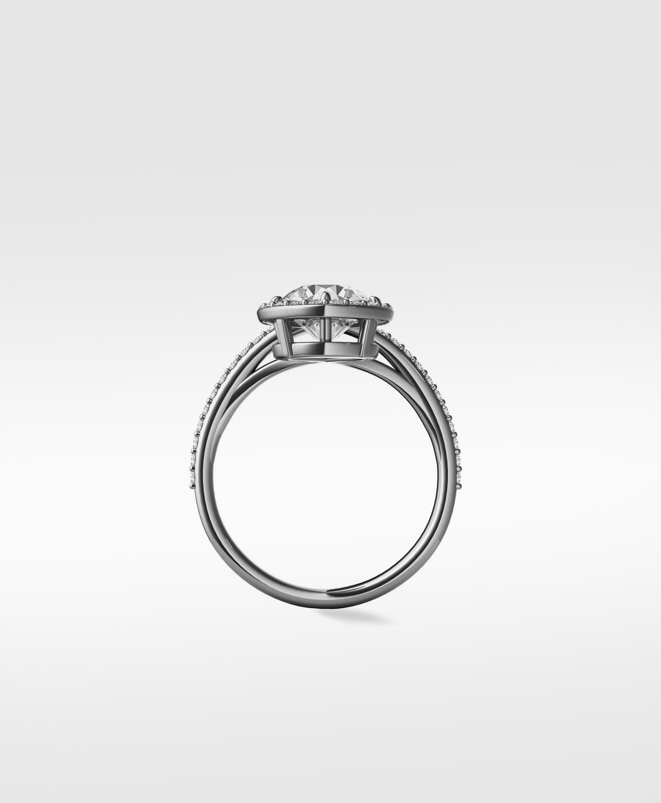 Side view of the Wild Cherry Diamond Engagement Ring with a halo setting and pavé split shank band.