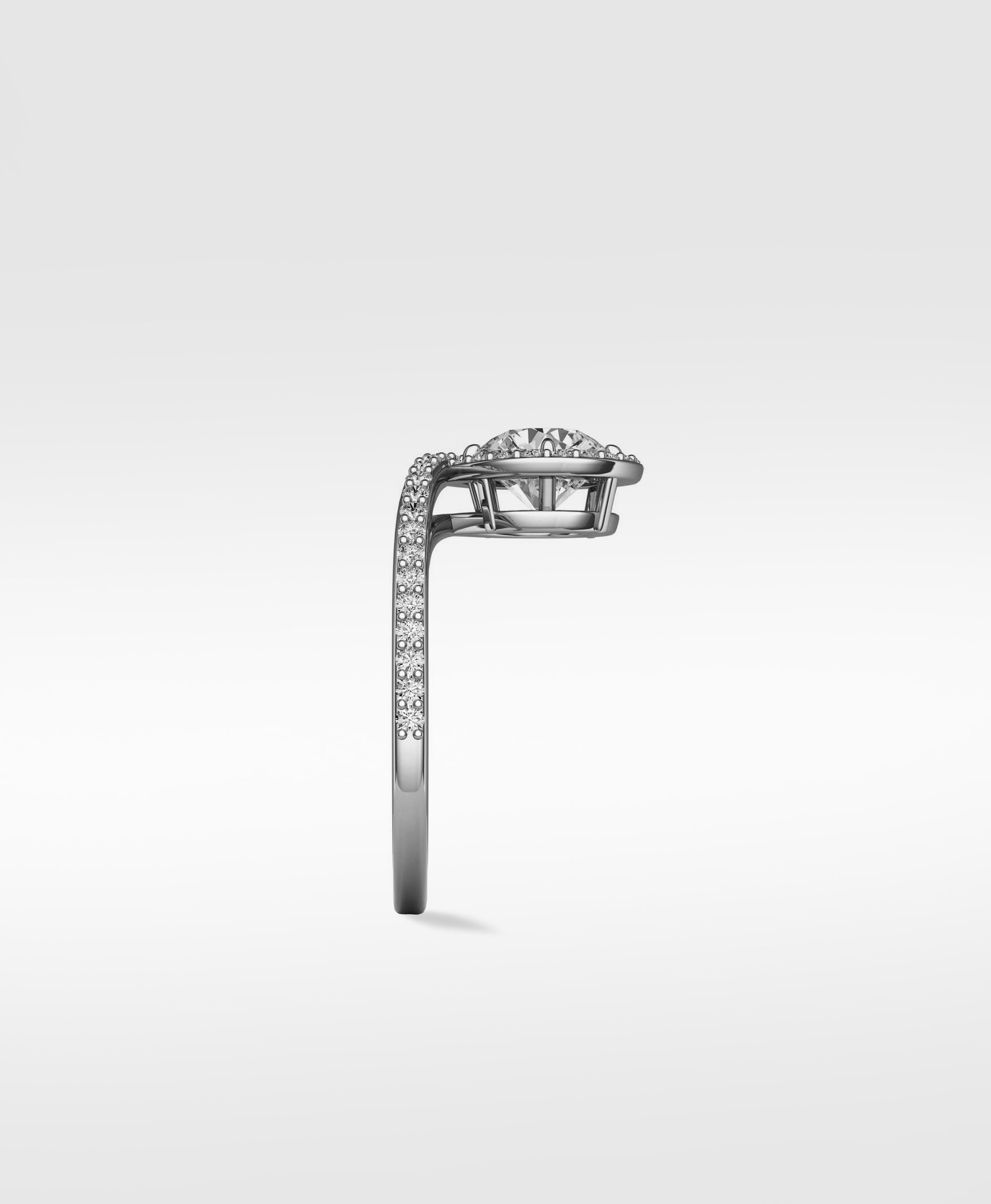 Side profile of the Wild Cherry Diamond Engagement Ring, showing its unique curved pavé diamond band and halo setting.