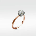 Walnut Engagement Ring with a rose gold band and a cushion-cut diamond in a white gold four-prong setting, on a white background.