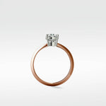 Side profile of the Walnut Engagement Ring with a rose gold band and a round brilliant cut diamond in a white gold setting.