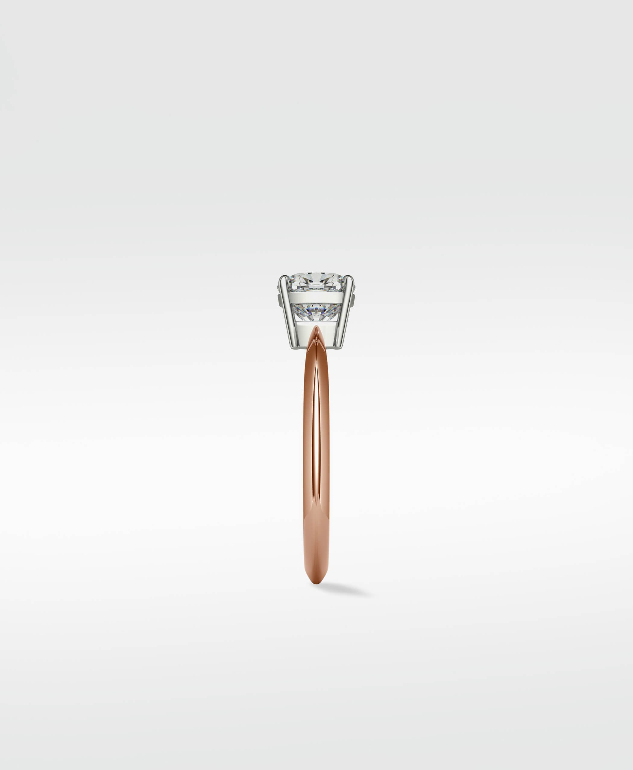 Side profile of the Walnut Engagement Ring with a rose gold band and a lab-grown diamond solitaire in a white gold setting.