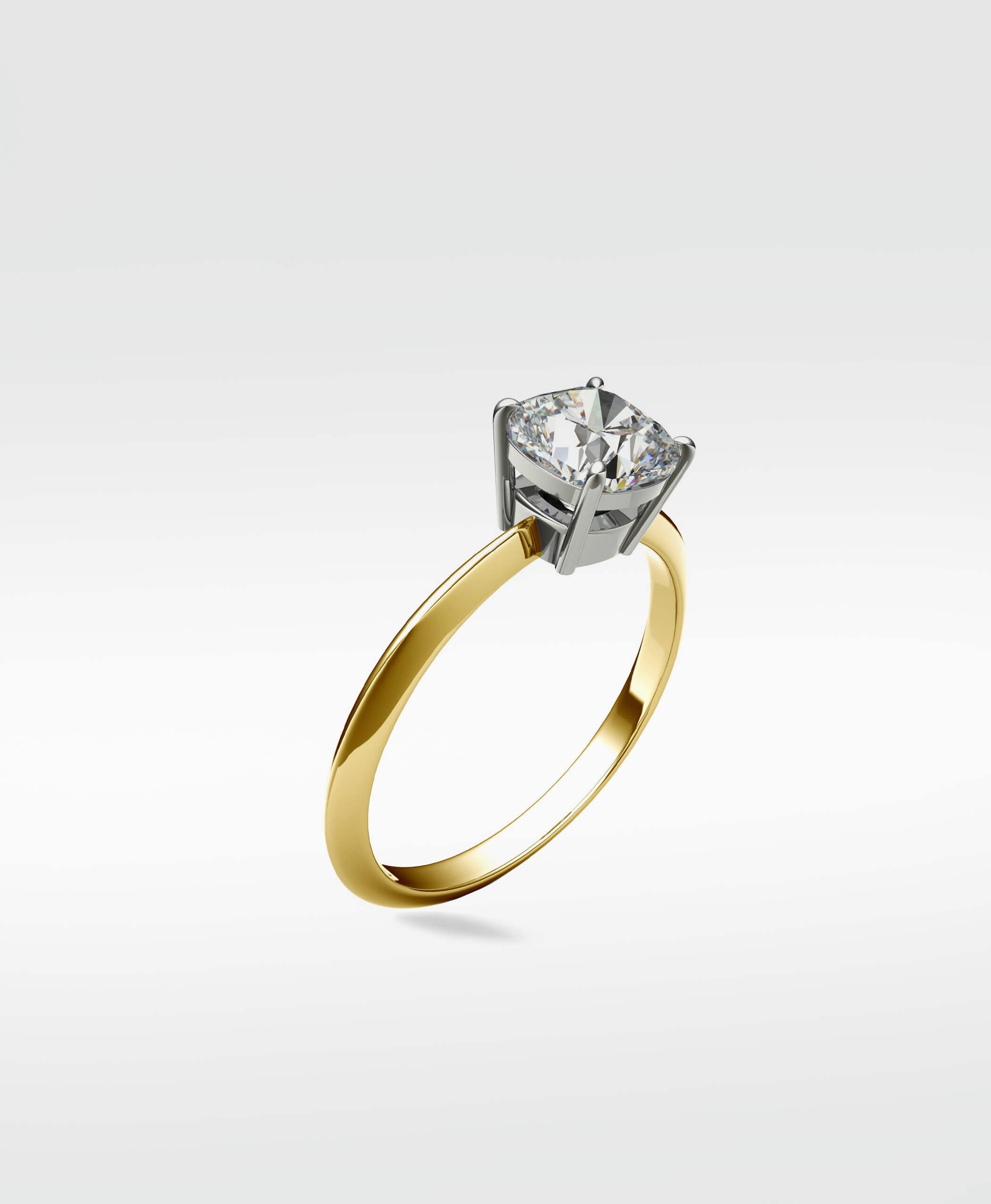 Lark & Berry Walnut Engagement Ring with a cushion cut diamond in a platinum prong setting on a yellow gold band.