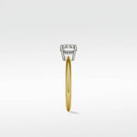 Side profile of the Walnut Engagement Ring with a round diamond in a white gold setting on a polished yellow gold band.