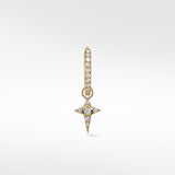 Celestial Diamond Charm in gold, with a diamond-studded hoop and a dangling star charm featuring a central round diamond.