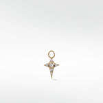 A yellow gold Celestial Diamond Charm shaped like a four-pointed star, set with a central and pavé diamonds.