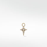 A yellow gold Celestial Diamond Charm shaped like a four-pointed star, set with a central and pavé diamonds.