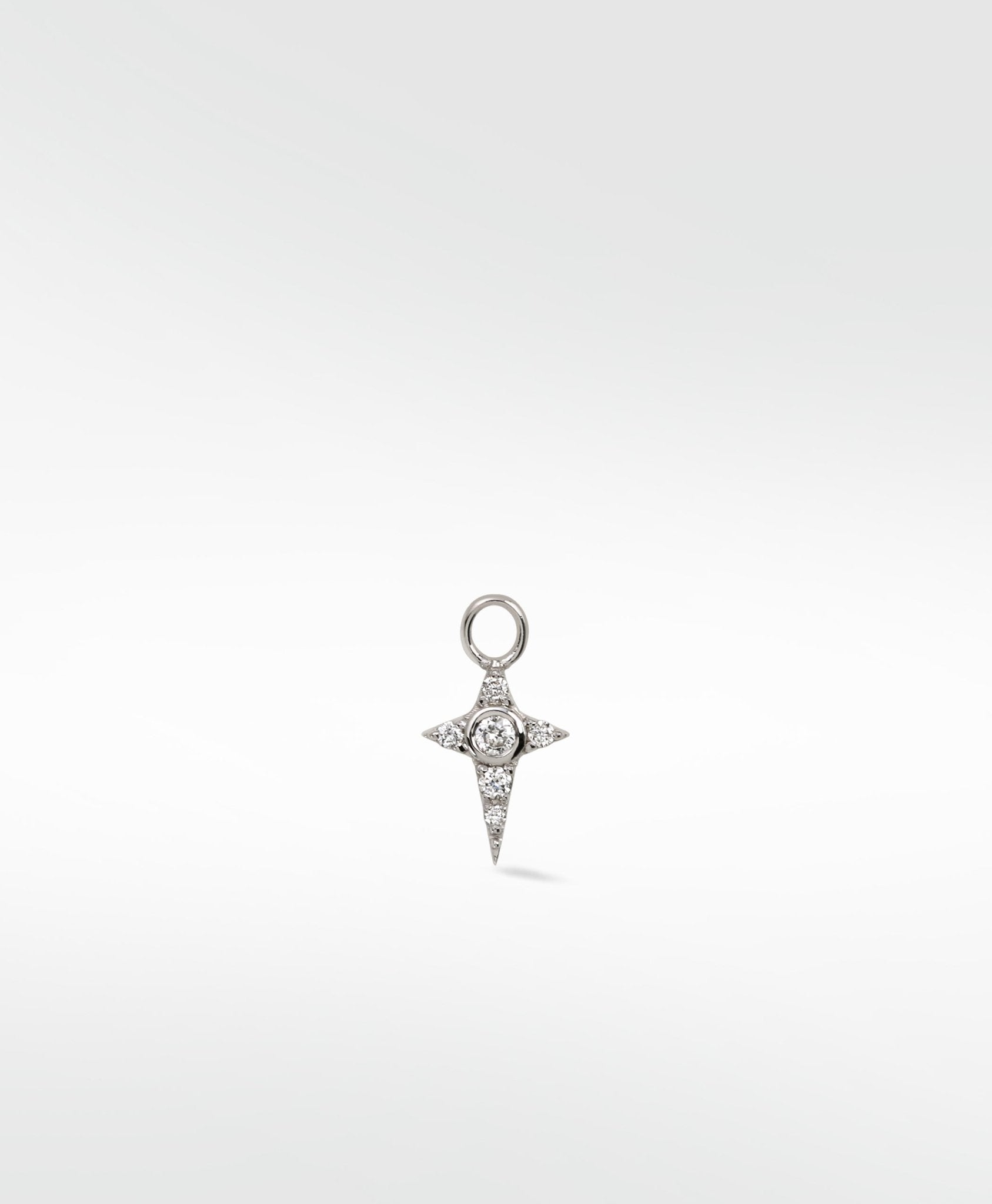A four-pointed star Celestial Diamond Charm in white gold with a central diamond and pavé accents on a white background.