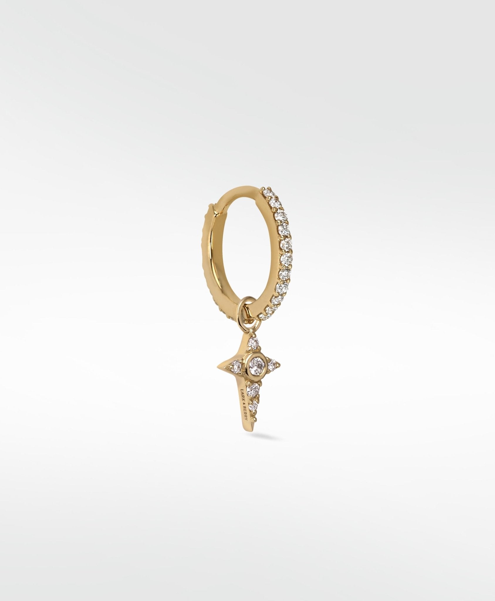 Lark & Berry Celestial Diamond Charm, a gold star set with diamonds, dangling from a pavé diamond hoop.