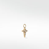 Lark & Berry's Celestial Diamond Charm in a gold, four-pointed star design set with a central round diamond and smaller accents.